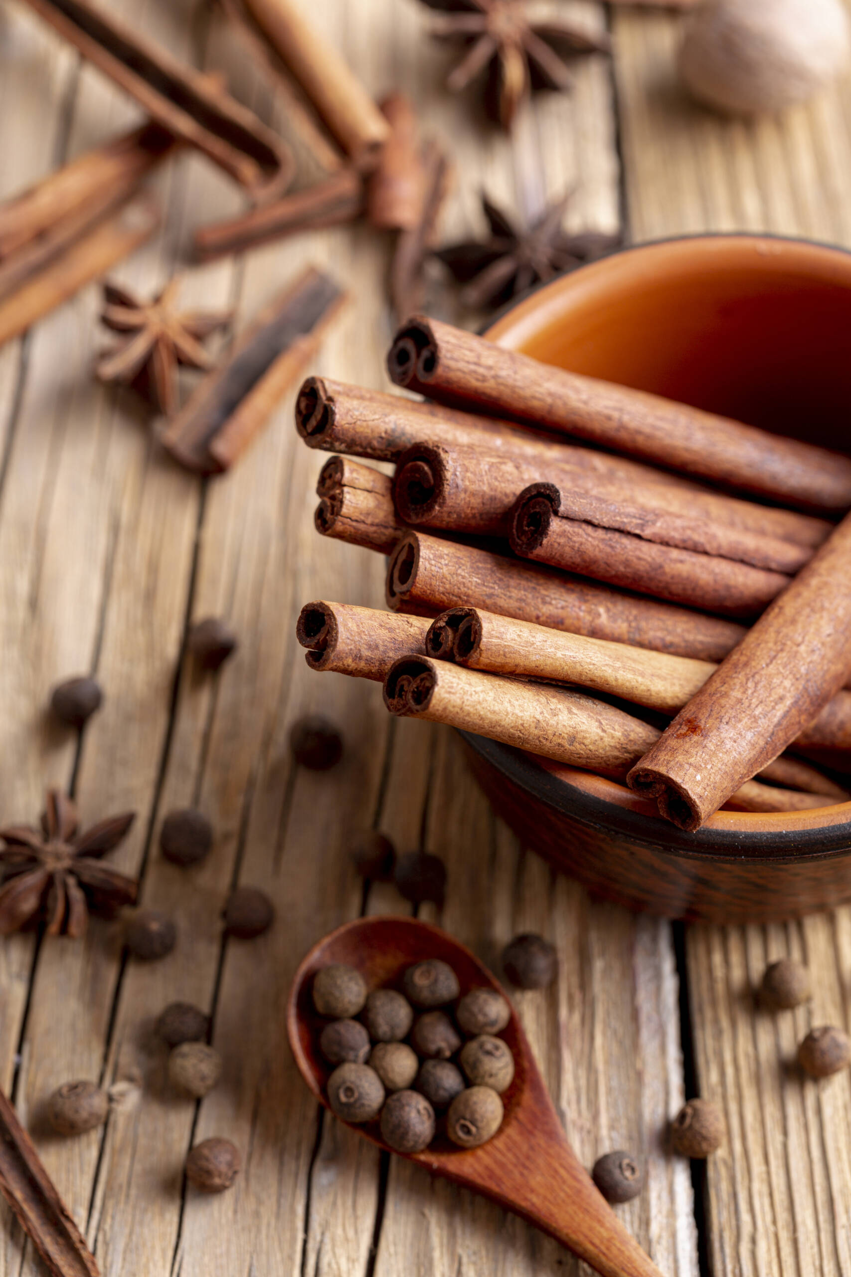 high-angle-bowl-with-cinnamon-sticks-star-anise-pepper